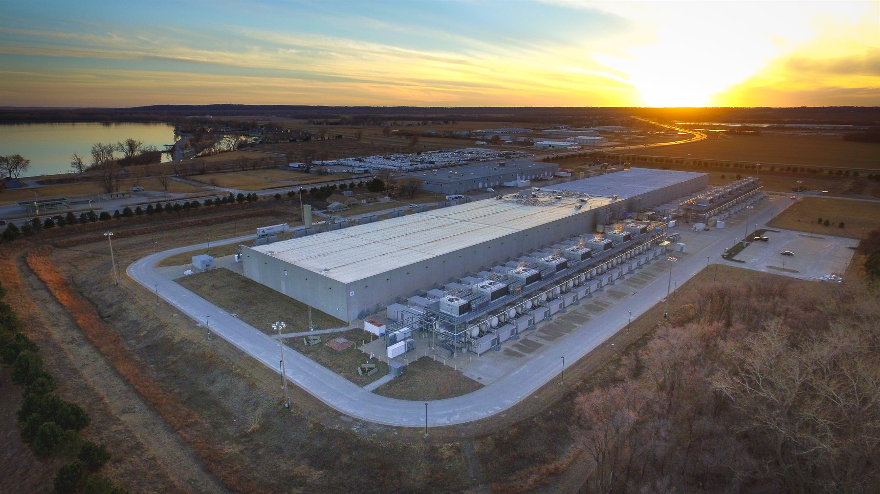 Aerial view of a large data center facility representing digital infrastructure and global cloud scale.
