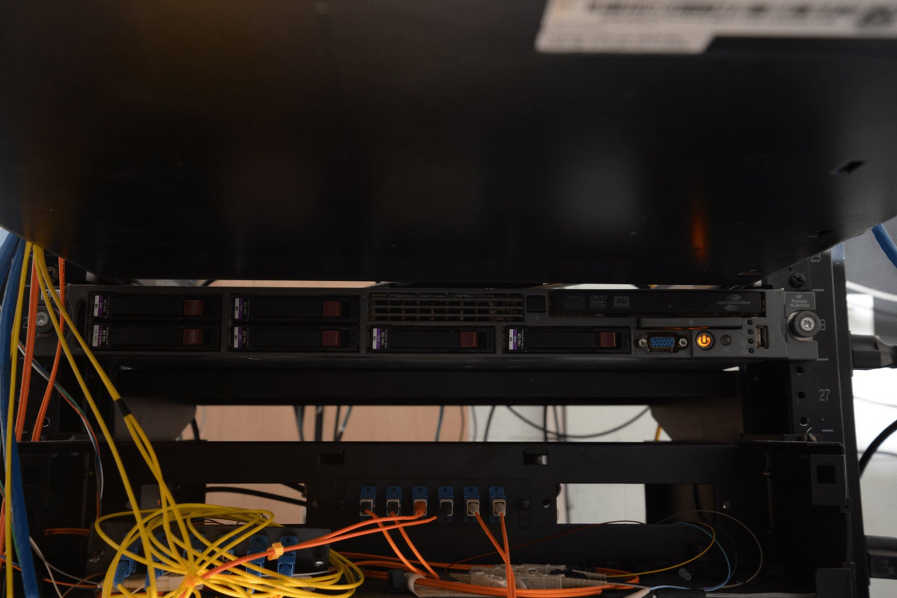 Server racks and cabling in a real data center environment.