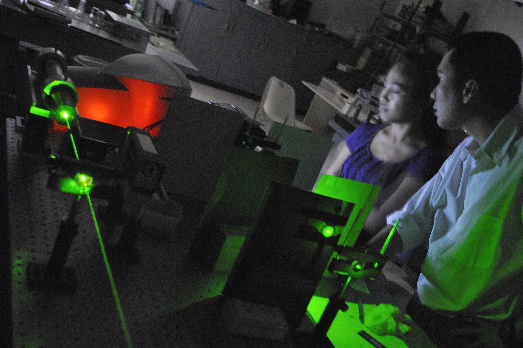 Laser and optical equipment in a university photonics laboratory.