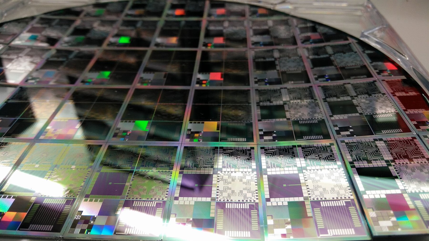 Semiconductor wafer with integrated circuits, representing chips, packaging and the AI supply chain.